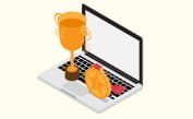 Una coppa e una corona dorate con un laptop